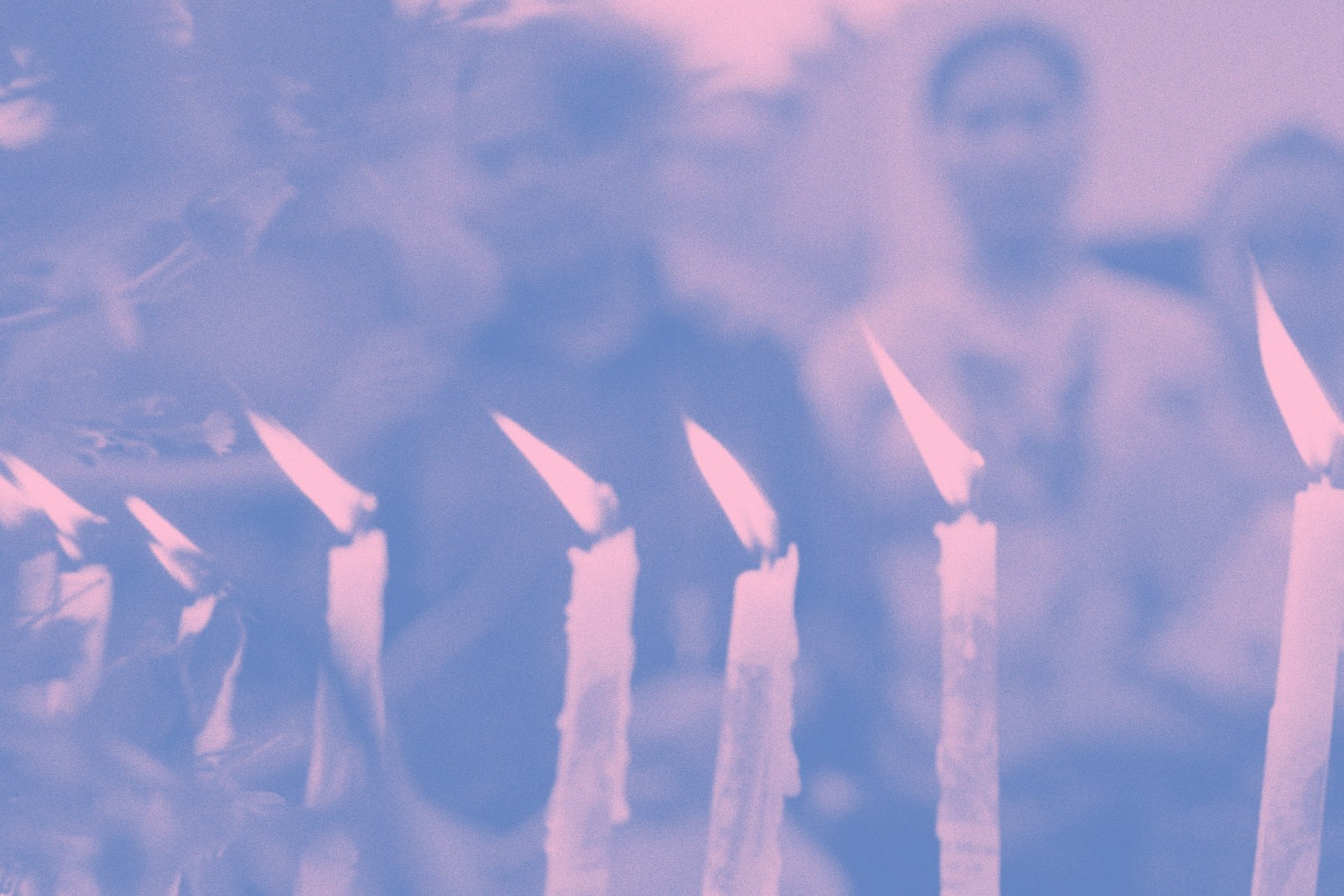 An image of lit candles in the foreground, people in the background. The image is awash in pink and blue gradients.